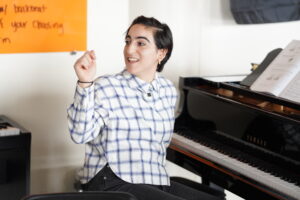 Mia Ibrahim (they/them), a music teacher at Health Opportunities High School.