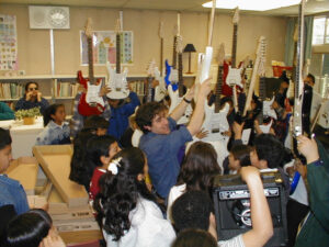 The Carlos Santana Foundation gifts each of the students their own electric guitar and amp. 